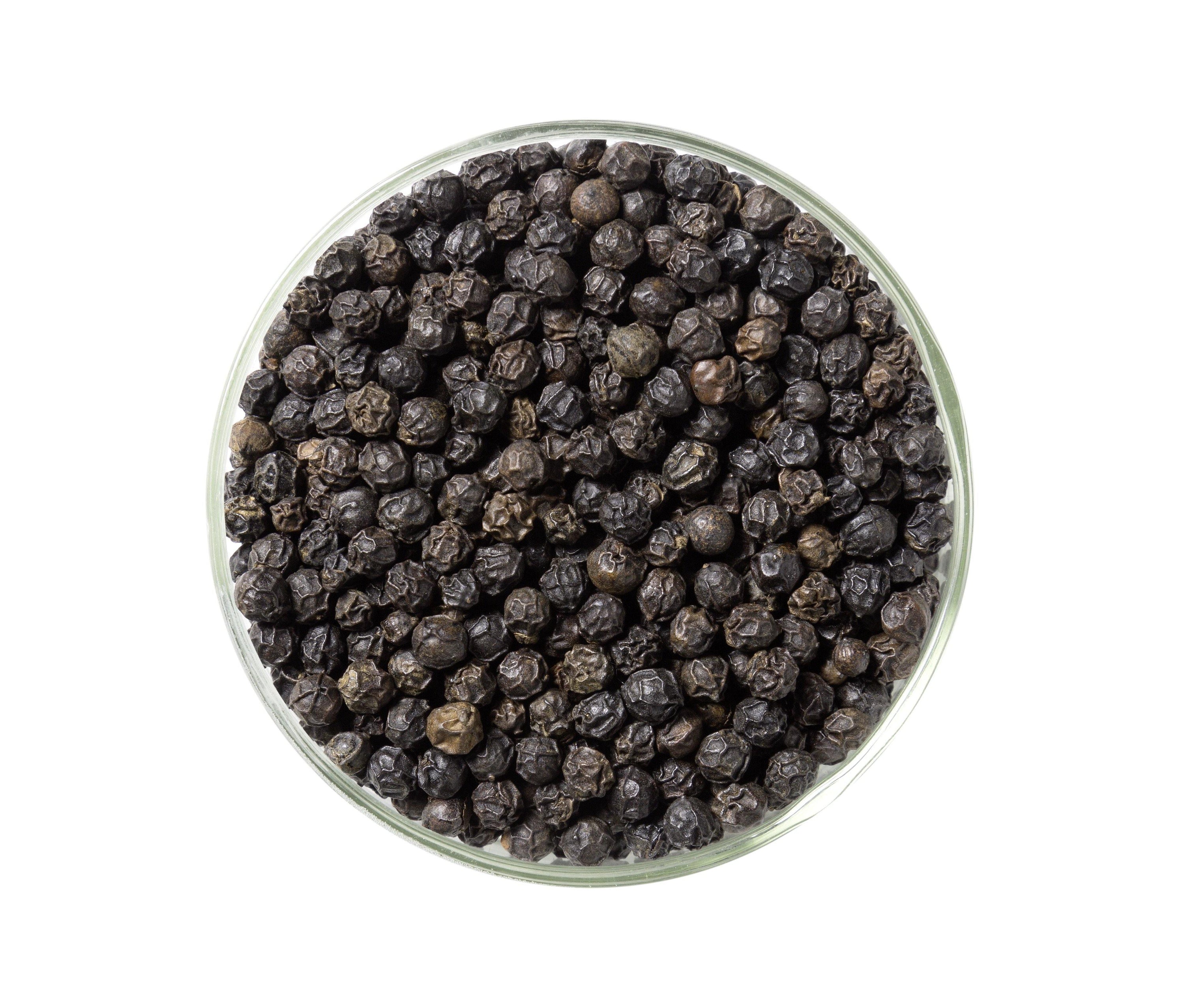 A glass jar of TIGER Pepper, also known as Malabar black pepper, showcasing its rich, dark peppercorns sourced from Kerala, India.