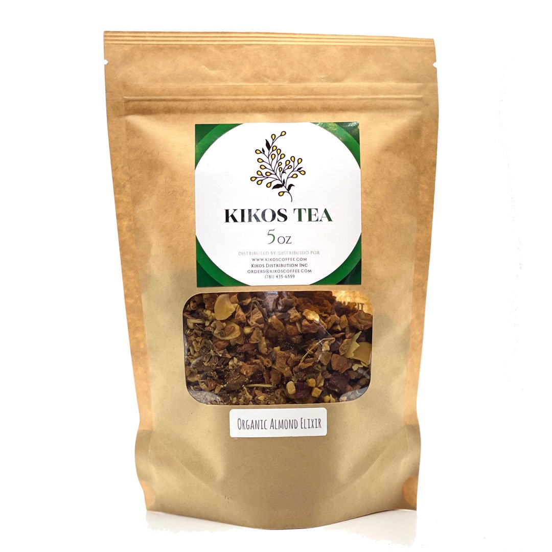 A vibrant package of Tisane Almond Elixir Tea featuring a blend of almonds, apple, and cinnamon, showcasing its fruity and aromatic qualities.