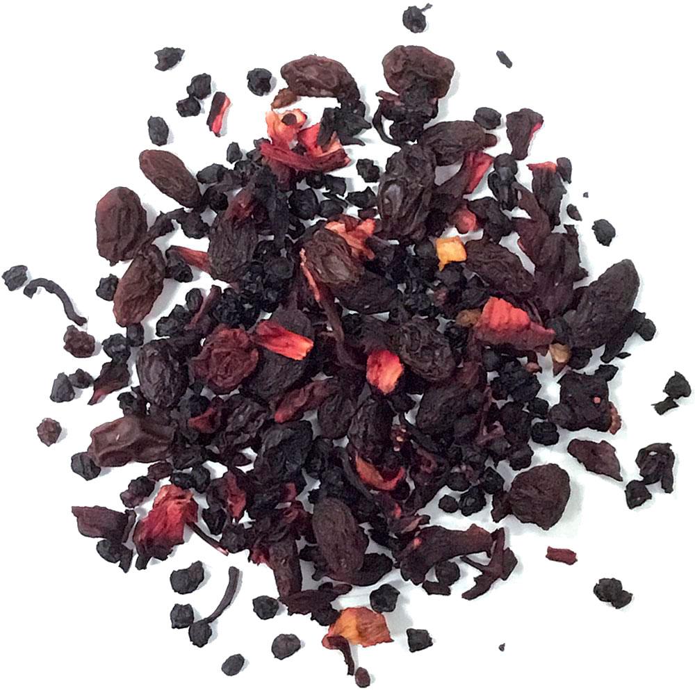 A vibrant package of Tisane Berry Passion Tea featuring a blend of black and red berries, grapes, and hibiscus, showcasing its rich aroma.