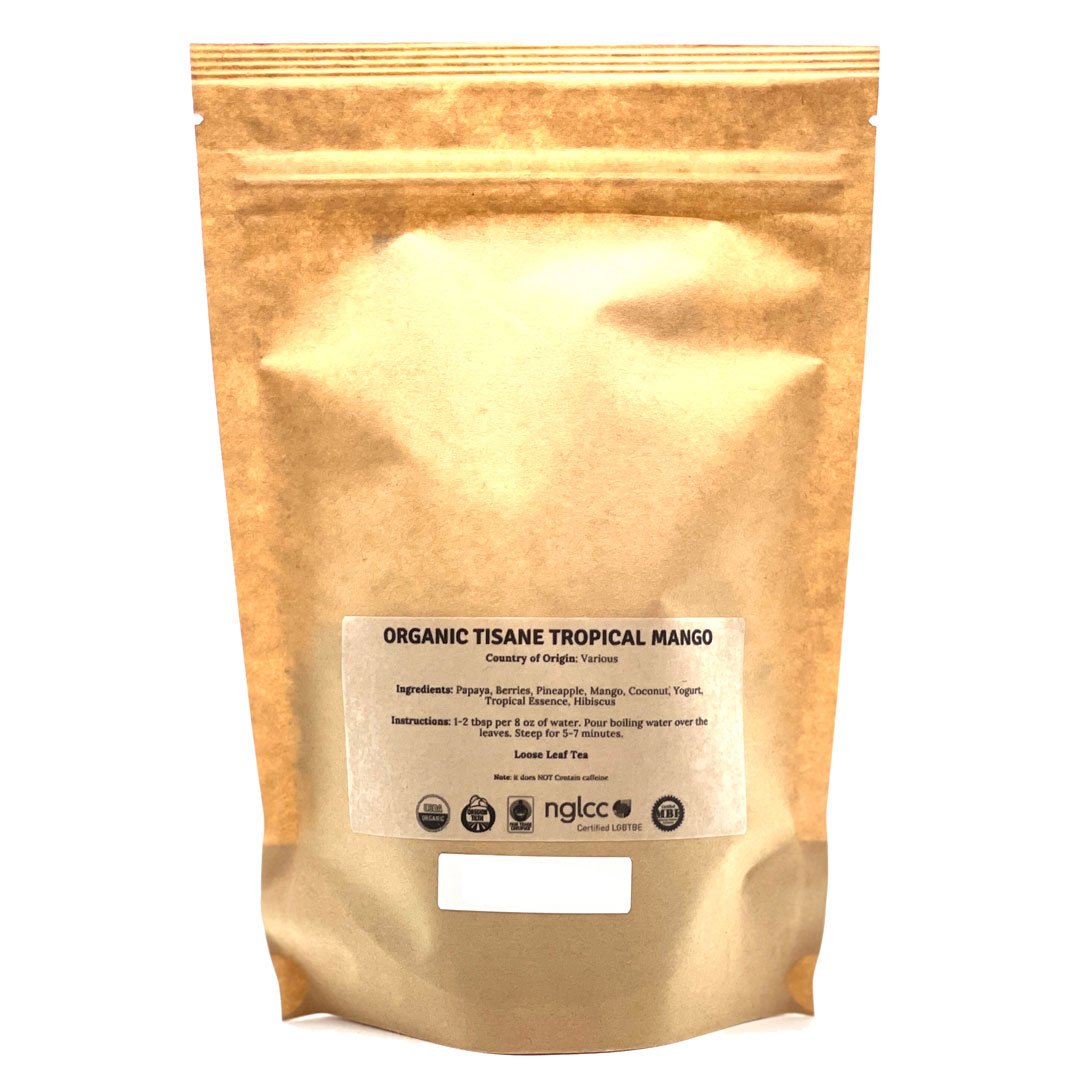 A vibrant package of Tisane Tropical Mango Tea featuring tropical fruits like mango, papaya, and coconut, with loose-leaf tea visible.