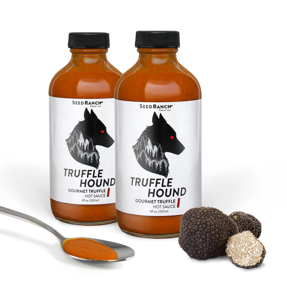 Truffle Hound 2 Pack featuring gourmet hot sauce with summer truffles and chili peppers, elegantly packaged.