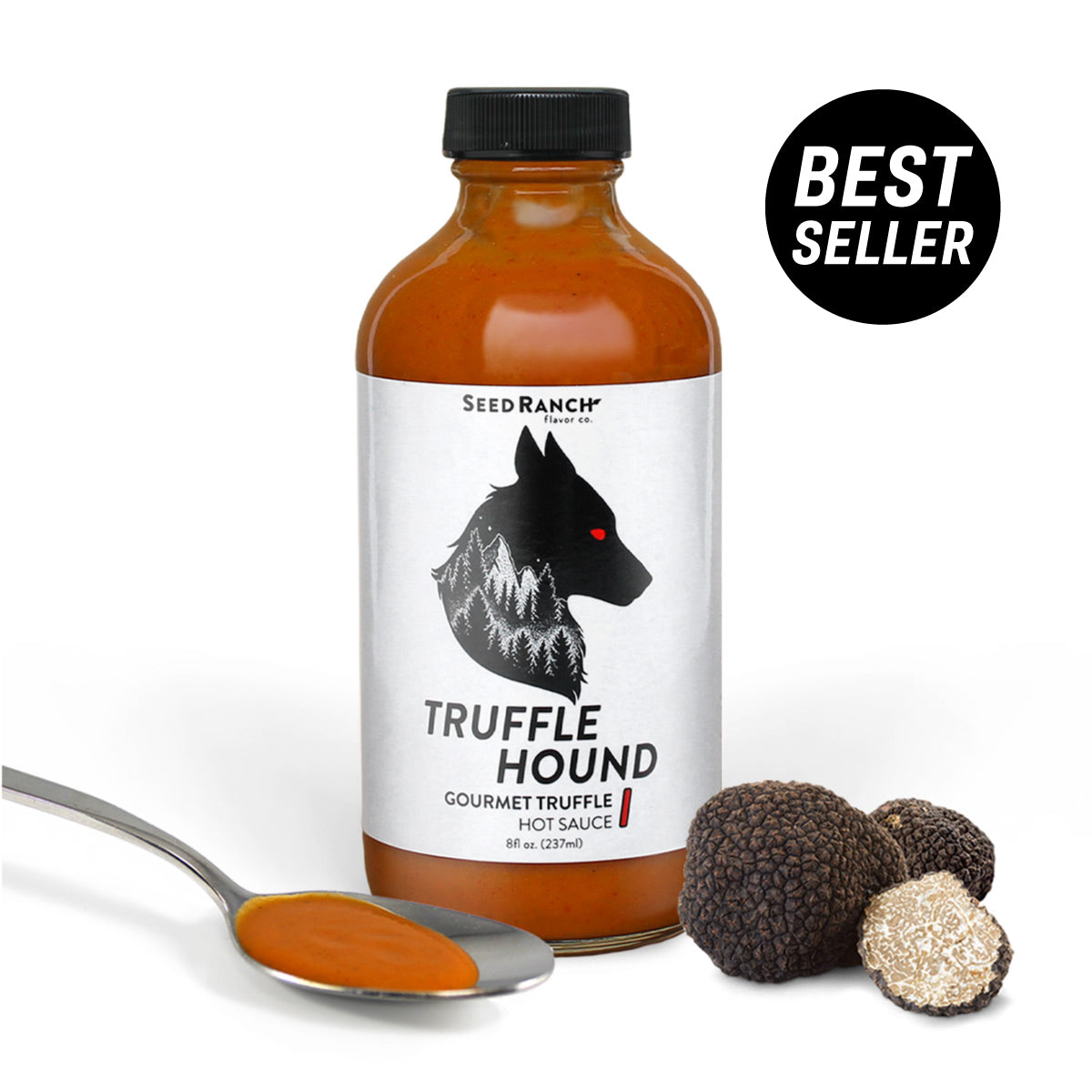 A bottle of Truffle Hound gourmet hot sauce featuring real summer truffles and organic chili peppers, elegantly designed for culinary enthusiasts.