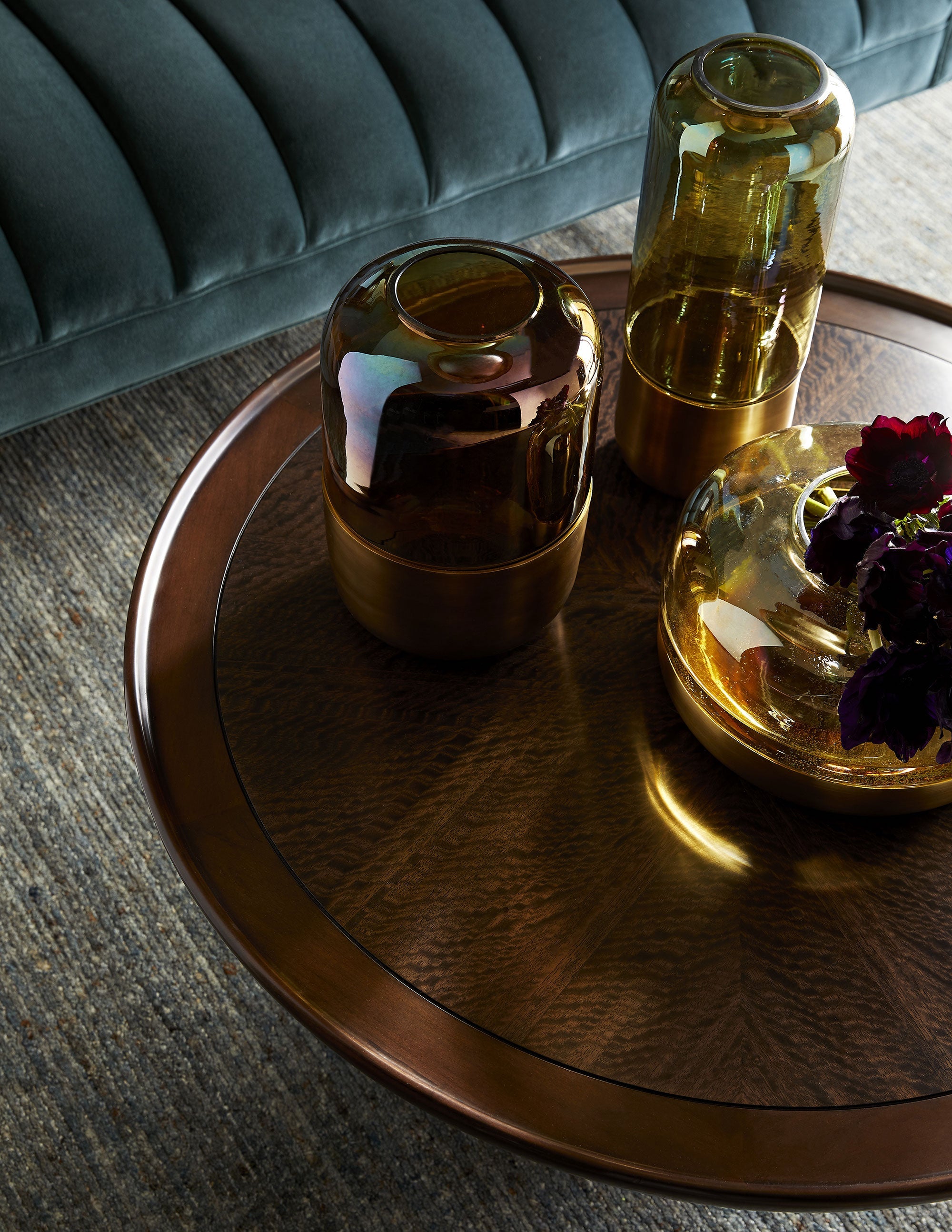 Violi Cocktail Table featuring a brindle finish and antique brass ring, showcasing geometric design and sturdy pedestal base.