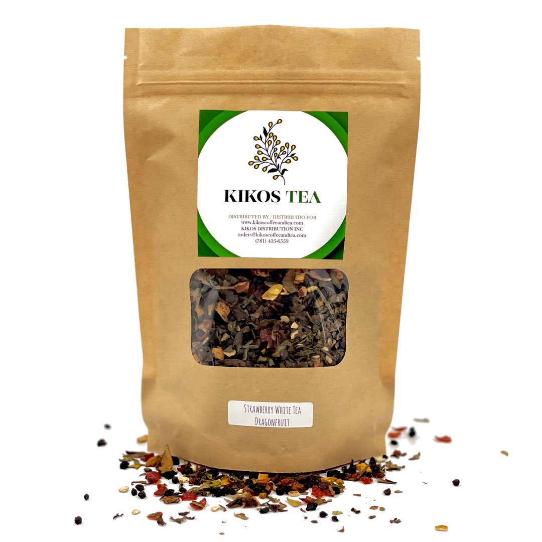 A vibrant cup of White Dragonfruit Berry Tea surrounded by tropical fruits and loose tea leaves, showcasing its exotic blend.