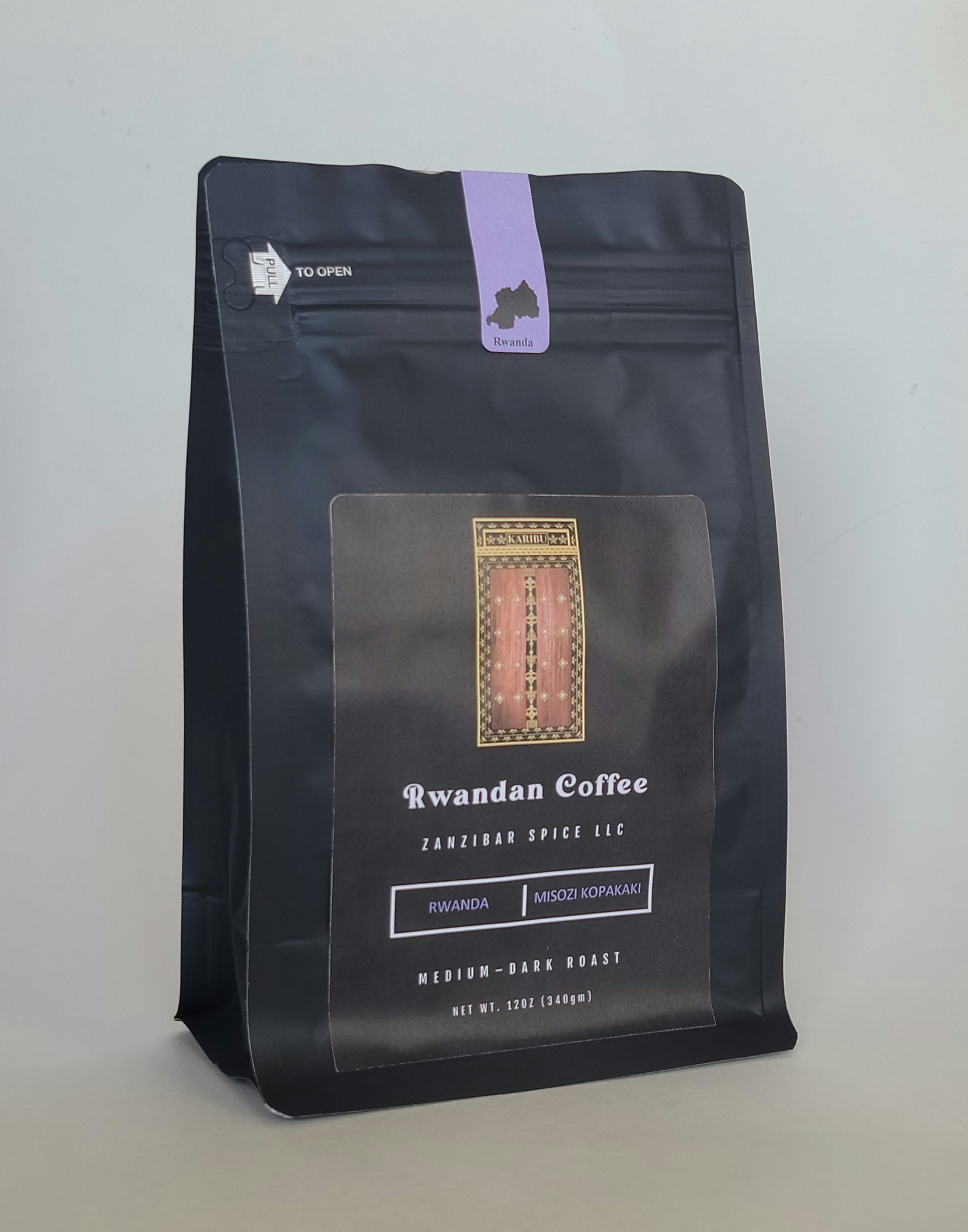 A 12oz resealable bag of Zanzibar Roast - Rwanda coffee, showcasing its rich, medium-dark roasted beans.