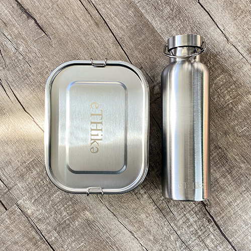 Zero Waste Starter Kit featuring a stainless steel lunchbox and water bottle, designed for eco-friendly meals and drinks.