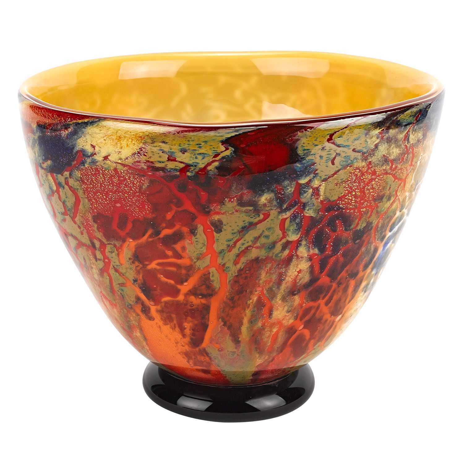 An 11-inch mouth blown art glass centerpiece bowl featuring a vibrant multi-color design, perfect for serving food and drinks.