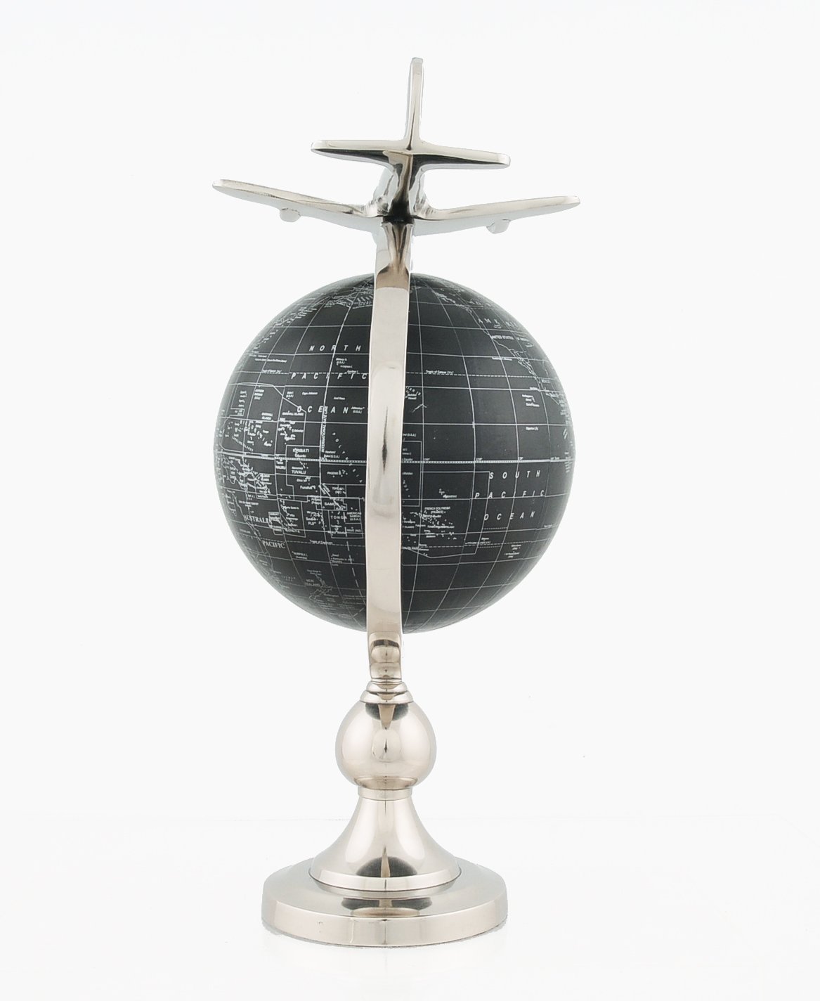 A vintage 1930s airplane model flying above a bronze-finished globe with silver writing, mounted on a brass stand.