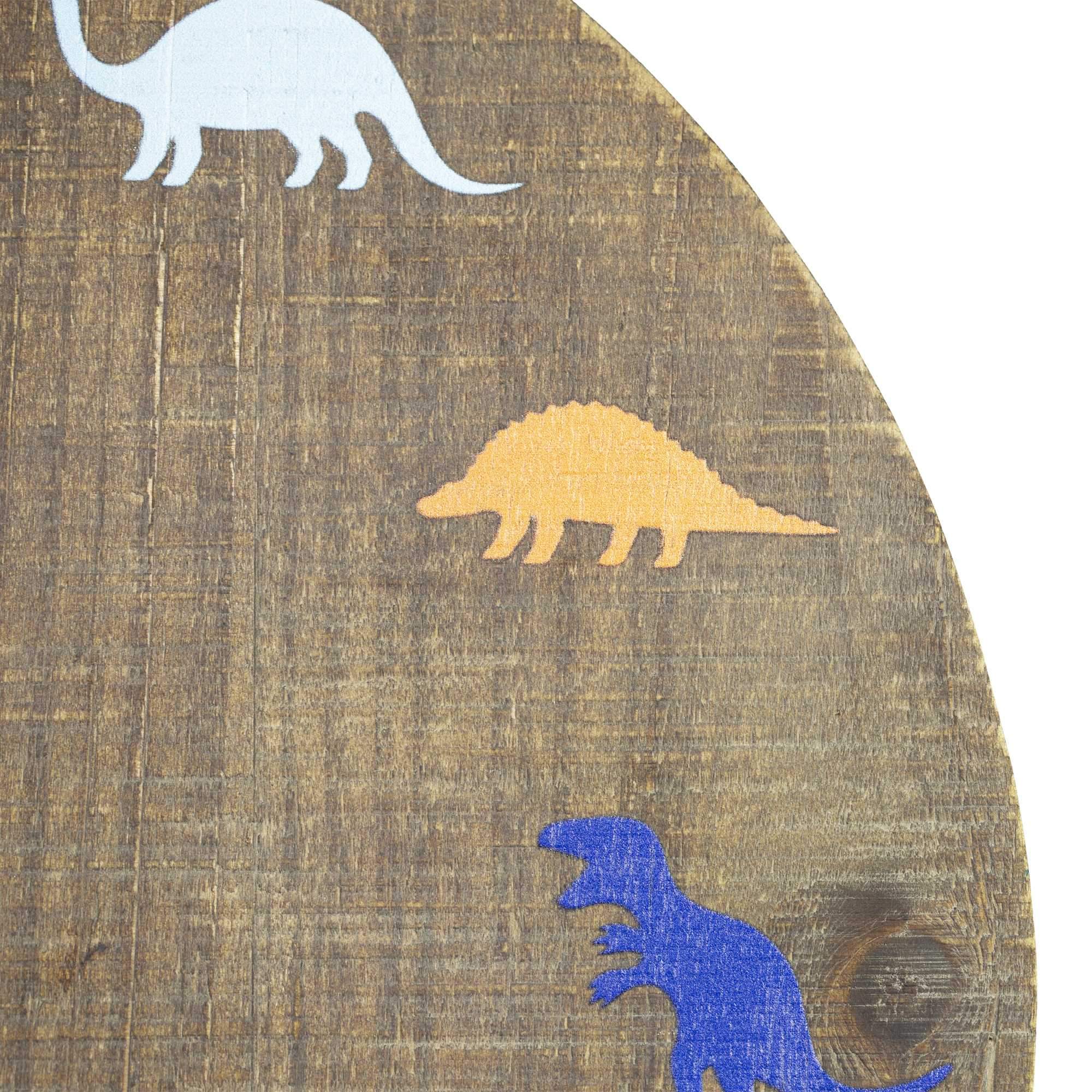 A colorful 12-inch round wall clock featuring various dinosaur outlines instead of numbers, designed for children's rooms.