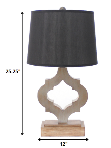 A traditional wooden table lamp featuring a black linen shade, elegantly designed to enhance home decor.