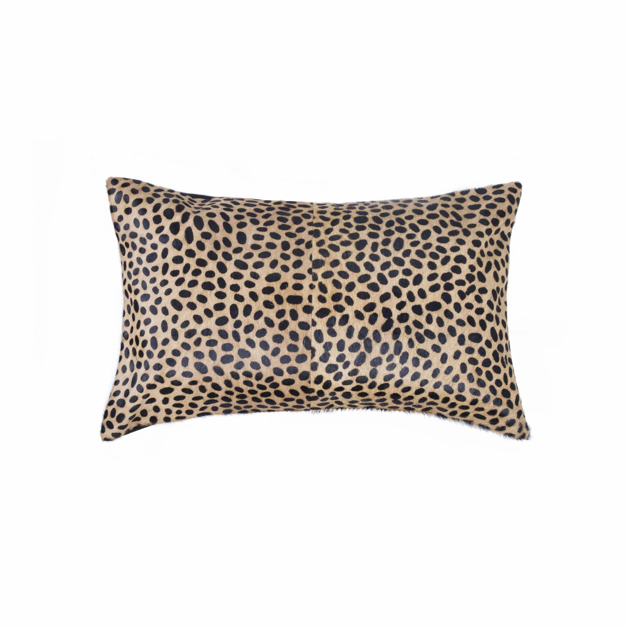 Luxurious 12x20 Cheetah Cowhide Pillow with soft microsuede backing and concealed zipper, showcasing unique mottling and hand-stitched design.