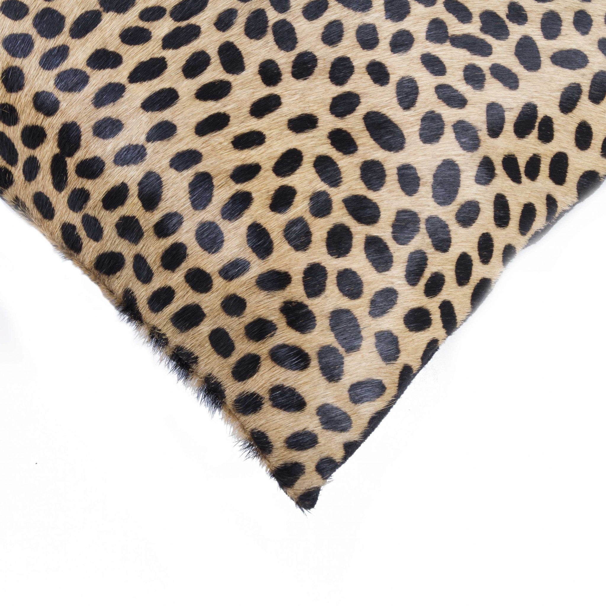 Luxurious 12x20 Cheetah Cowhide Pillow with soft microsuede backing and concealed zipper, showcasing unique mottling and hand-stitched design.