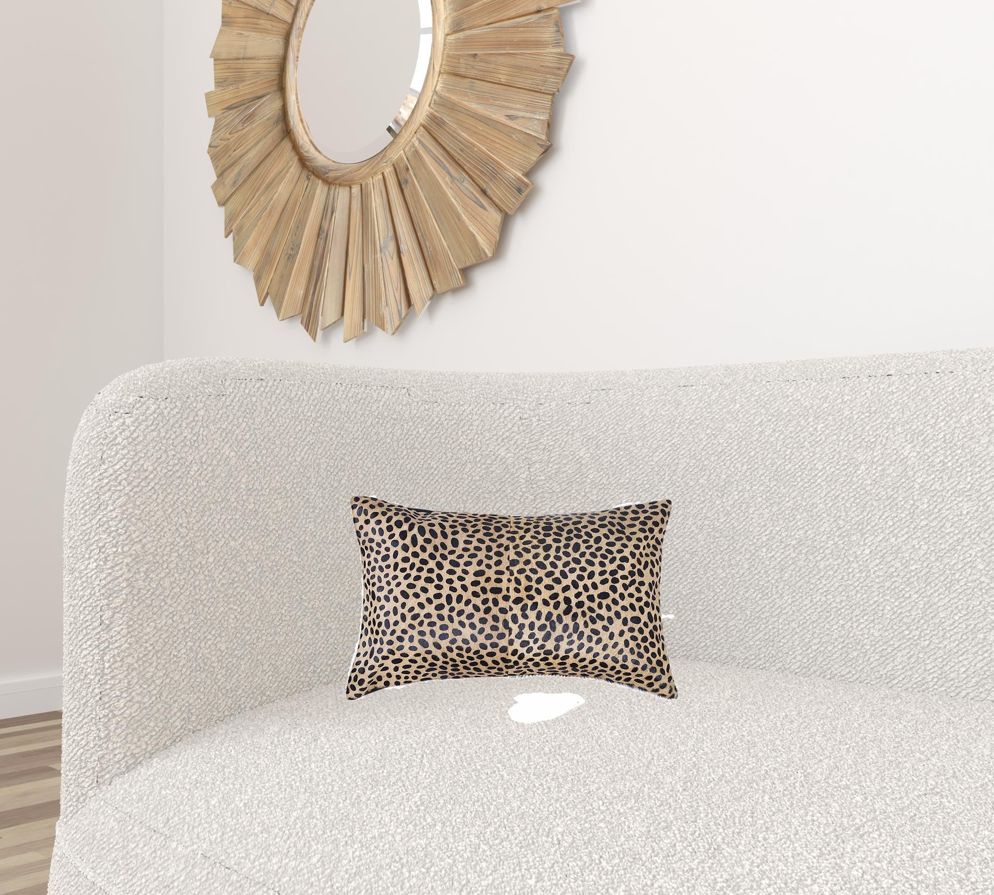 Luxurious 12x20 Cheetah Cowhide Pillow with soft microsuede backing and concealed zipper, showcasing unique mottling and hand-stitched design.