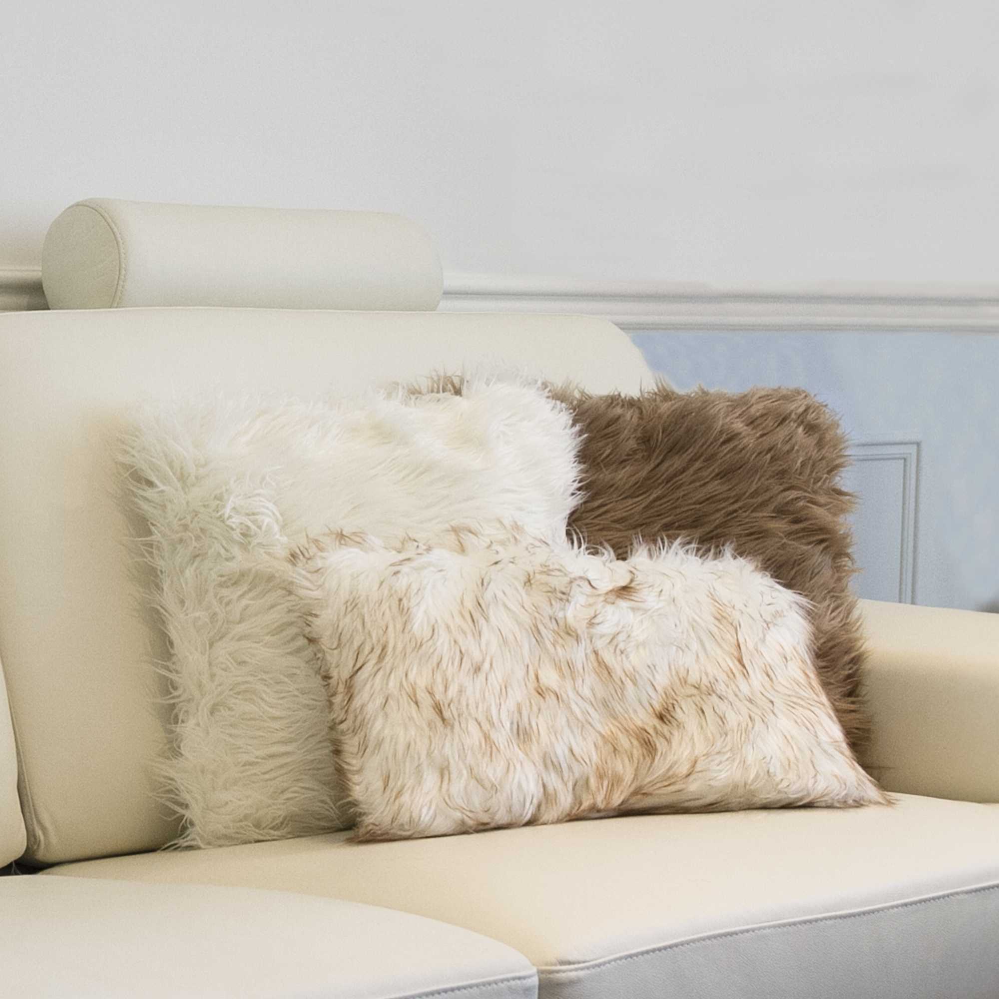 Two luxurious gradient tan faux fur pillows, measuring 12x20 inches, showcasing a plush texture and elegant design, perfect for home decor.