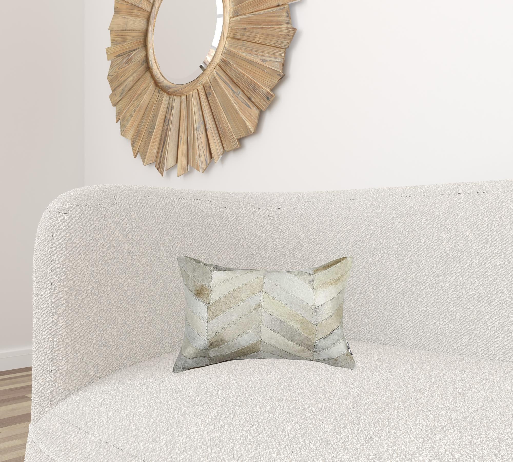 A luxurious 12x20 natural pillow made from Indian cowhide with a soft microsuede backing, featuring a concealed zipper closure.