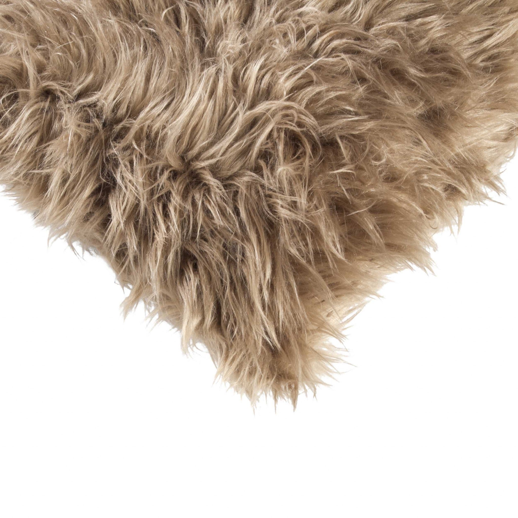 Two luxurious tan faux fur pillows, 12x20 inches, showcasing plush texture and elegant design, perfect for home decor.