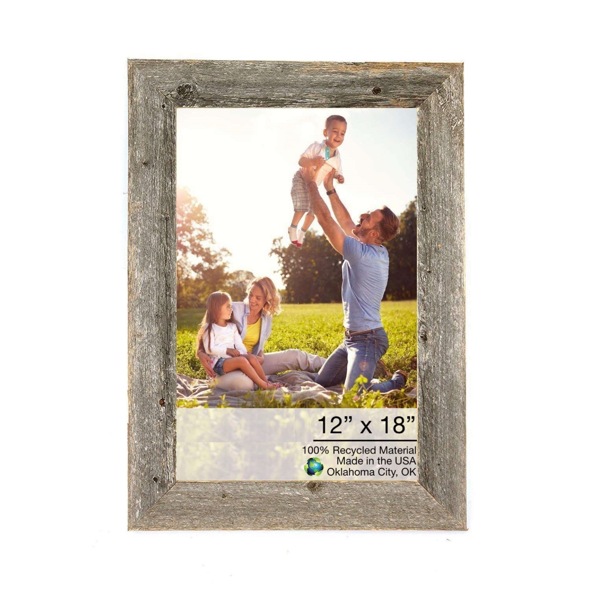 A rustic 12x18 natural weathered grey picture frame made from reclaimed wood, showcasing a beautiful photo.