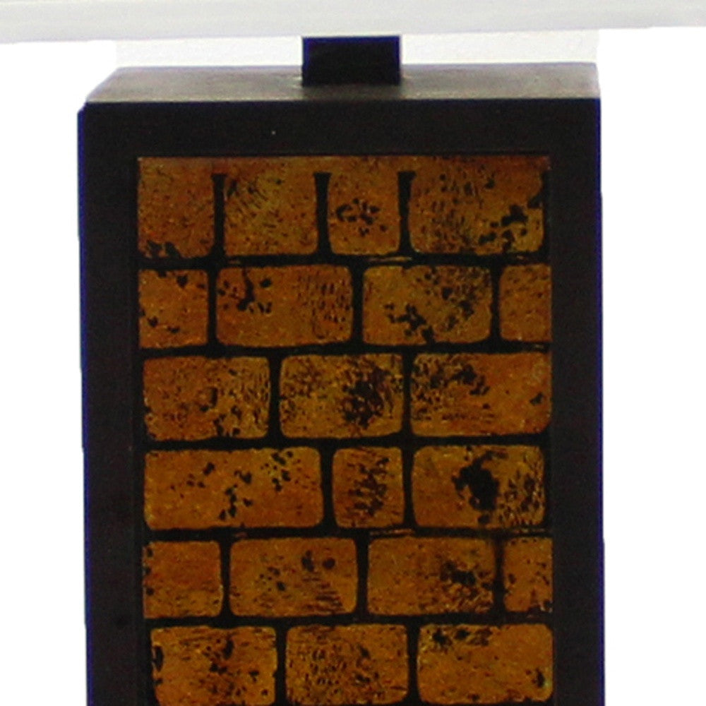 A contemporary black metal table lamp featuring a vibrant yellow brick pattern base and a white linen shade, perfect for modern home decor.