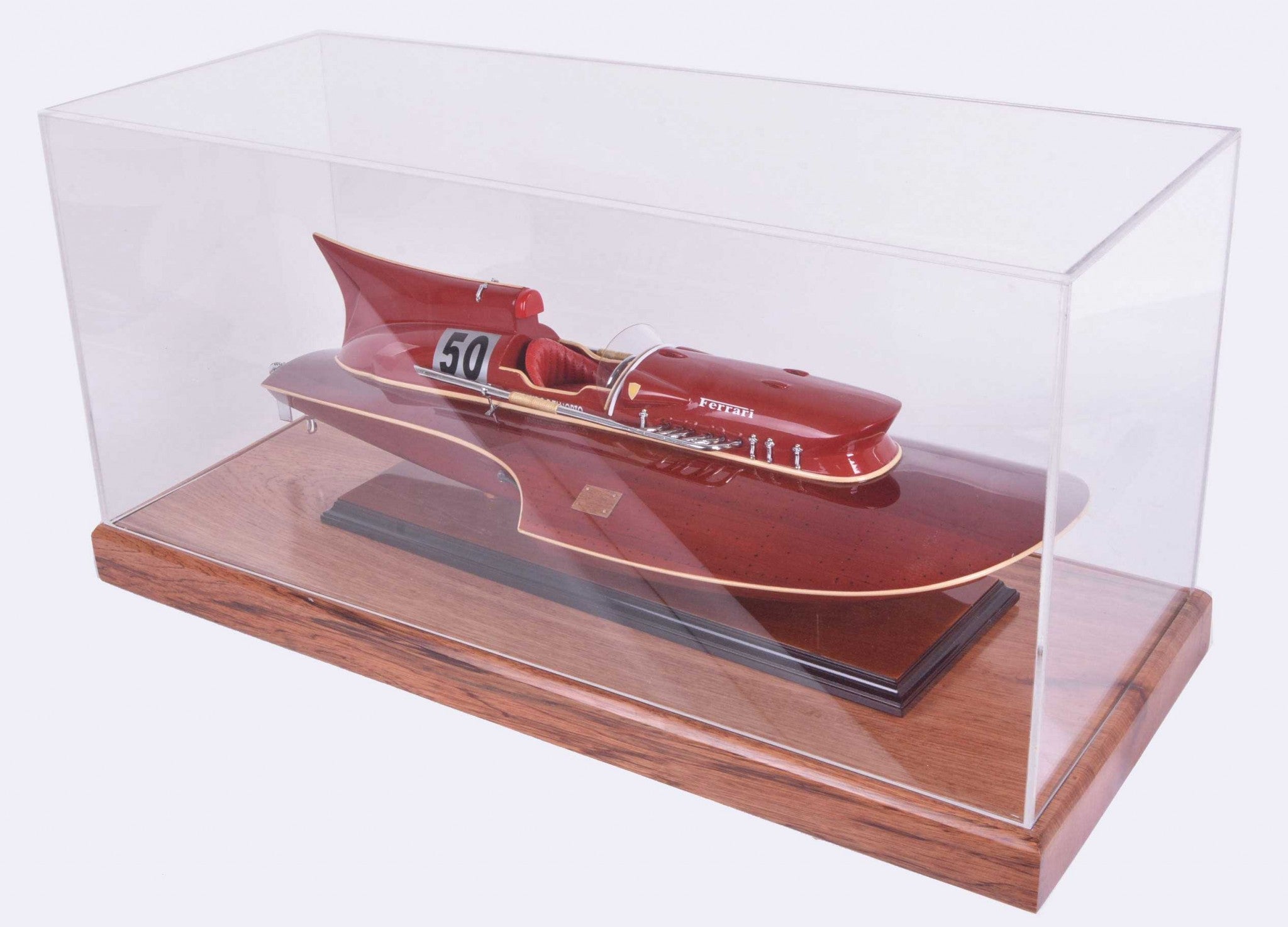 Elegant hardwood display case with plexiglass panels showcasing a midsize speedboat, perfect for collectors.