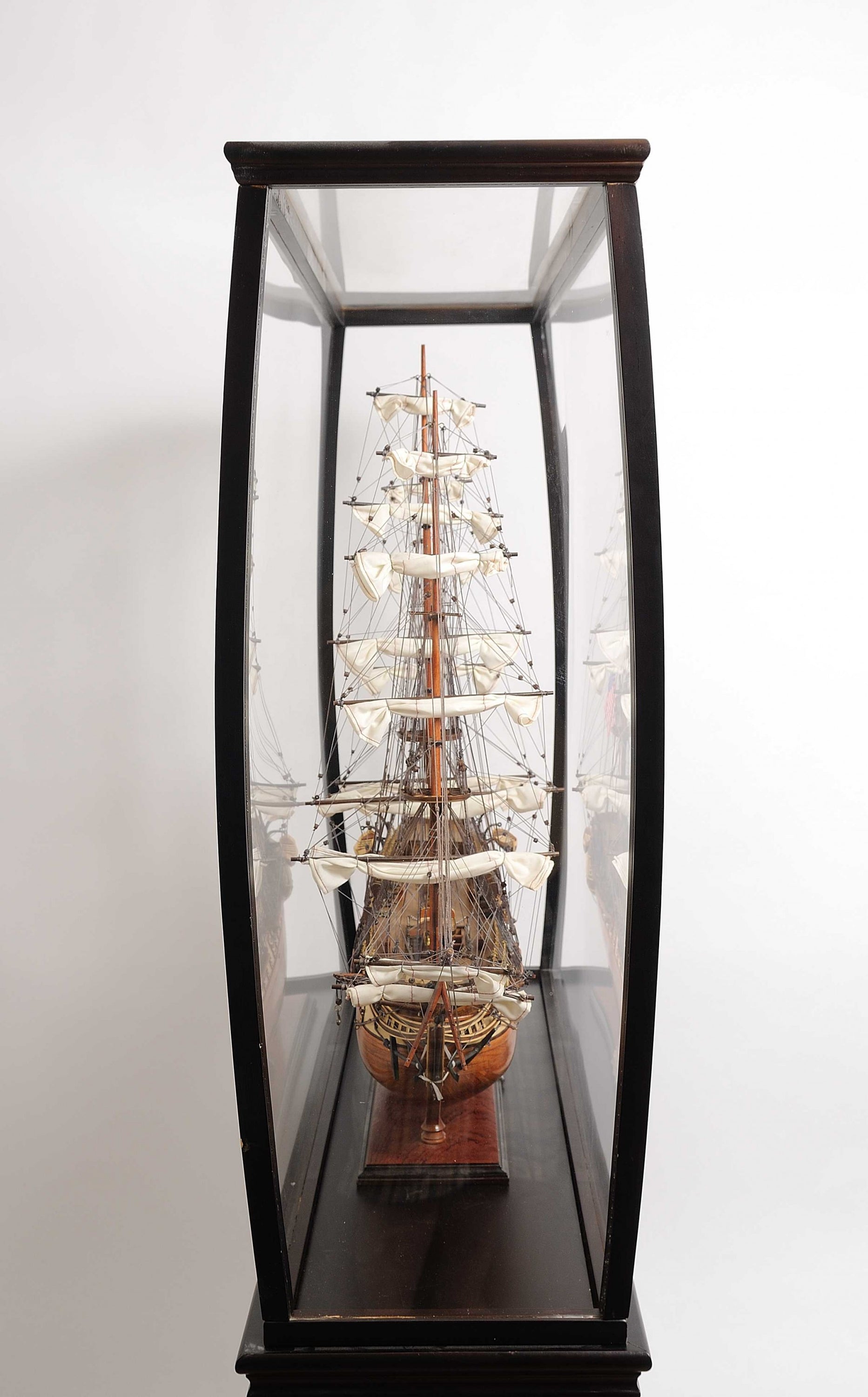 Elegant 69-inch floor display case made of hardwood with dark mahogany finish and plexiglass panels, showcasing tall ship models.