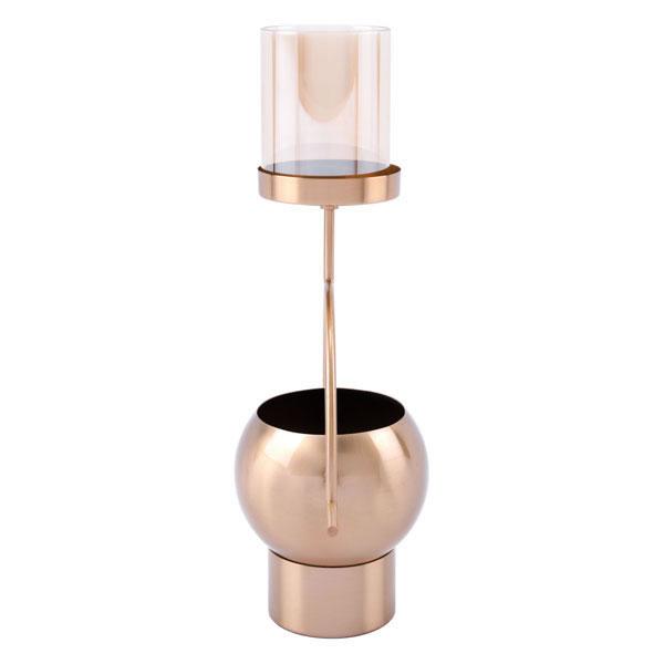 Antique brass candle holder with tinted glass cylinder, elegantly designed for home decor.