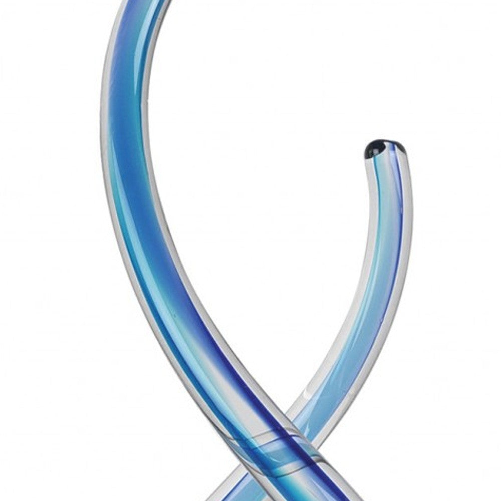 14-inch contemporary blue art glass centerpiece with twisting design on a clear crystal base, showcasing vibrant blue hues.