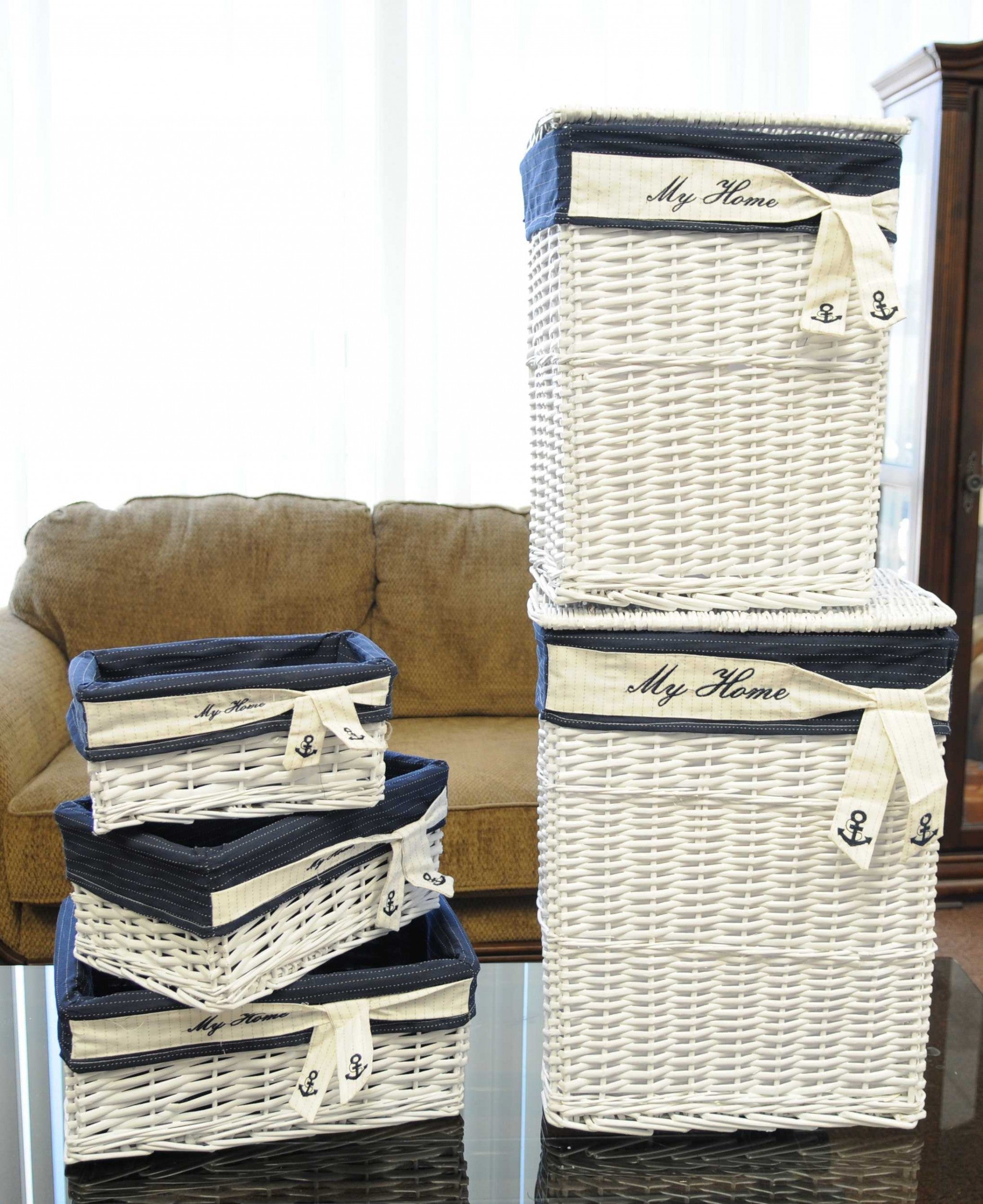 A set of five rectangular willow baskets in white and blue, showcasing their elegant design and various sizes for versatile storage.