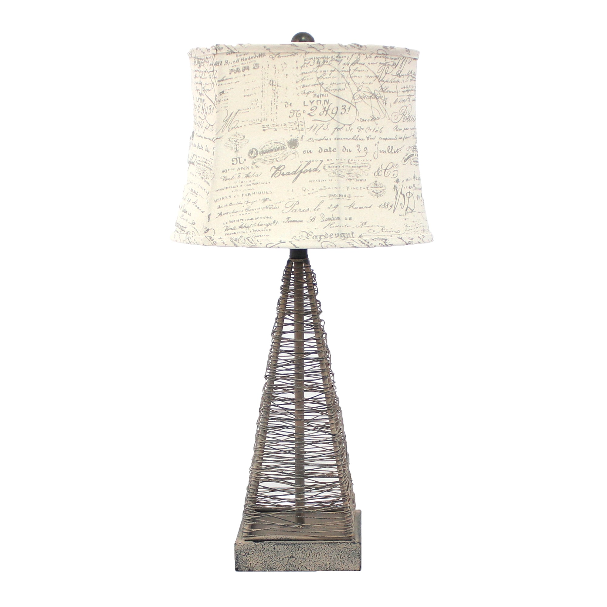 Tan industrial metal table lamp with a cone wire mesh base and round white linen shade, perfect for home decor.