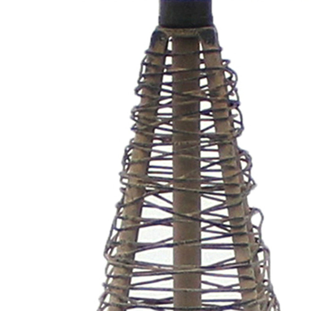 Tan industrial metal table lamp with a cone wire mesh base and round white linen shade, perfect for home decor.