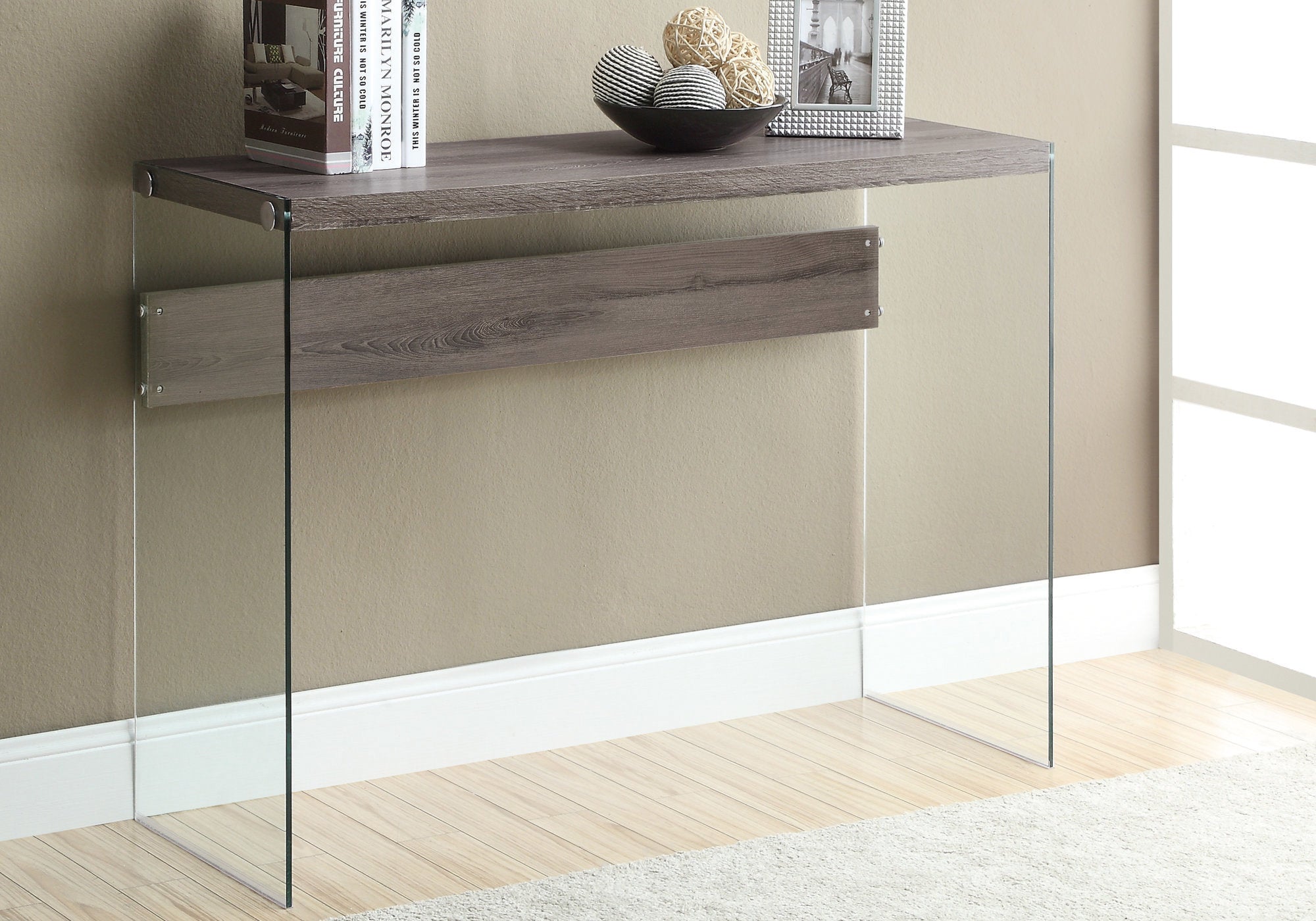 Elegant dark taupe accent table with clear tempered glass top, showcasing a stylish design suitable for any room.