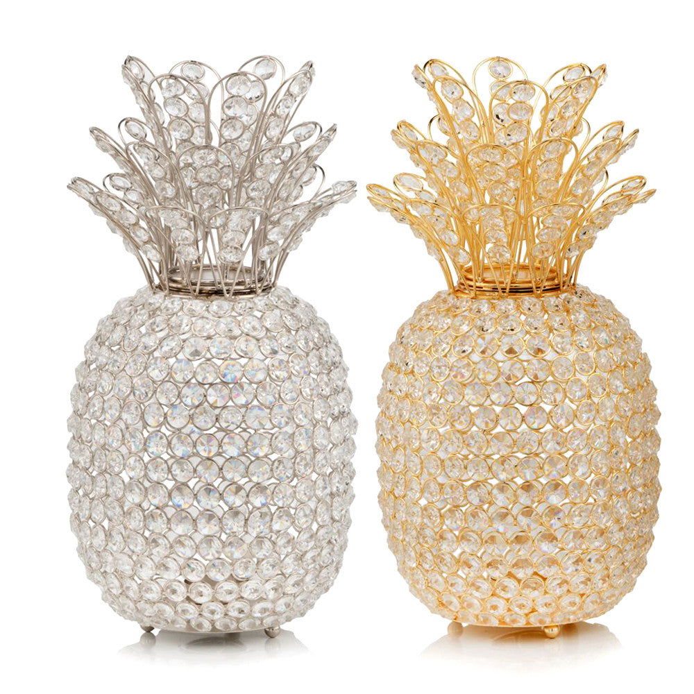 A stunning 15-inch gold pineapple sculpture adorned with faux crystals, resting on a silver base, perfect for home decor.