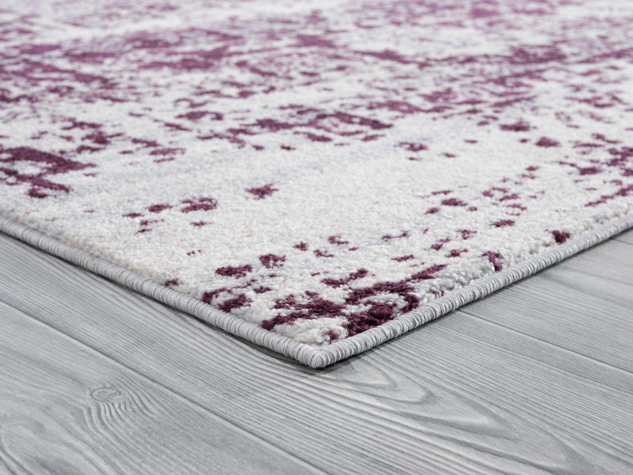 A large 116" x 158" Wine Olefin/Frieze Rug featuring a vintage design in wine plum and ivory colors with a distressed look.