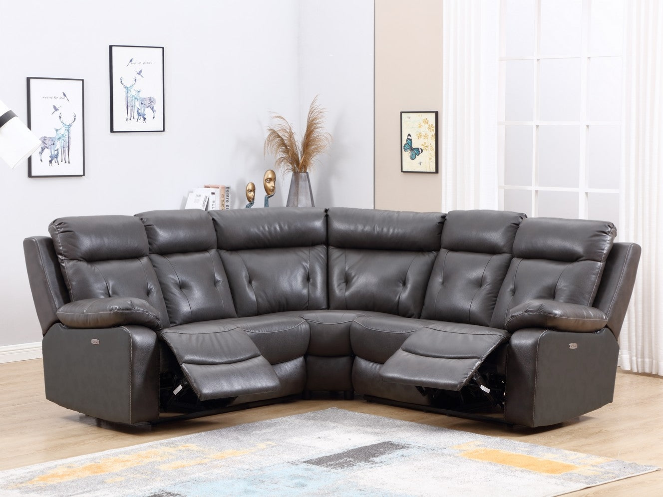 Modern dark gray leather sectional sofa with power recliners, featuring a center console and USB charging ports.