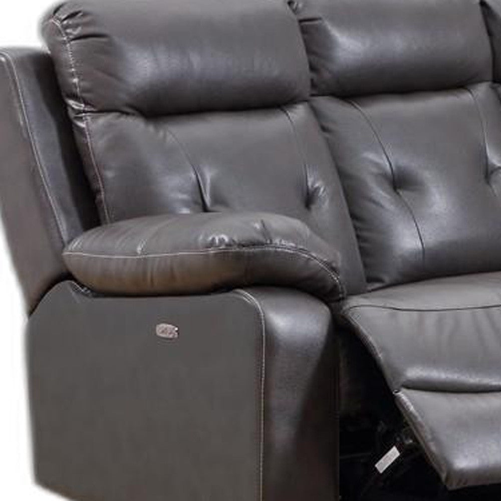 Modern dark gray leather sectional sofa with power recliners, featuring a center console and USB charging ports.