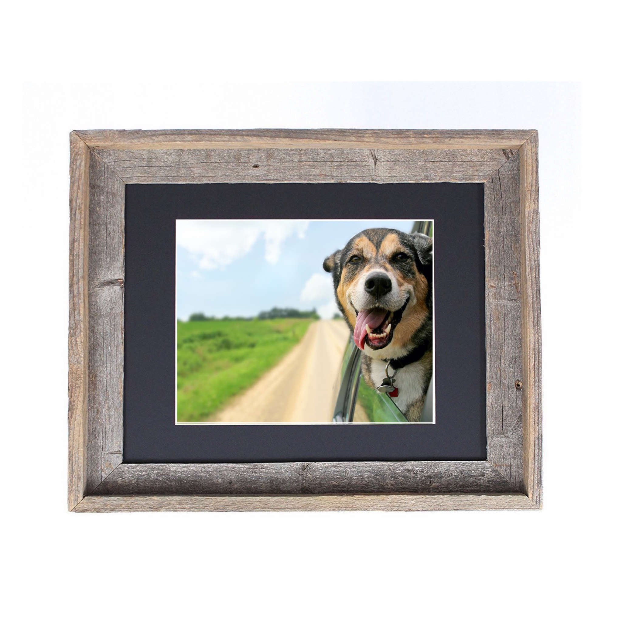 A rustic black picture frame measuring 16x20 inches, made from reclaimed wood with a plexiglass holder, showcasing a beautiful photo.