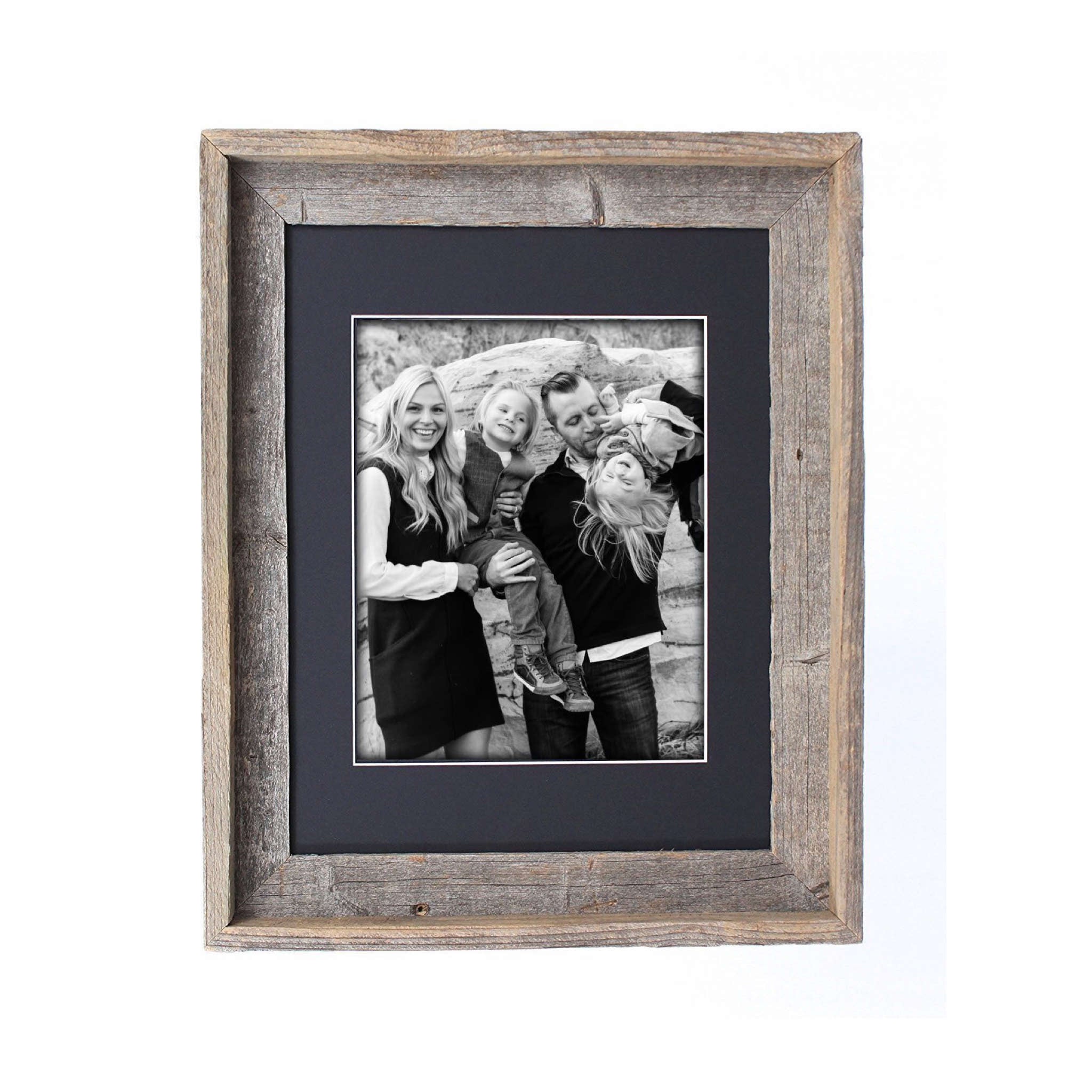 A rustic black picture frame measuring 16x20 inches, made from reclaimed wood with a plexiglass holder, showcasing a beautiful photo.