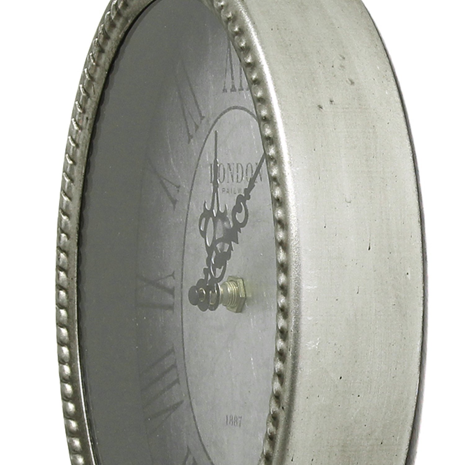 11.75-inch oval vintage wall clock with Roman numerals and antique silver background, showcasing a stylish metal and glass design.