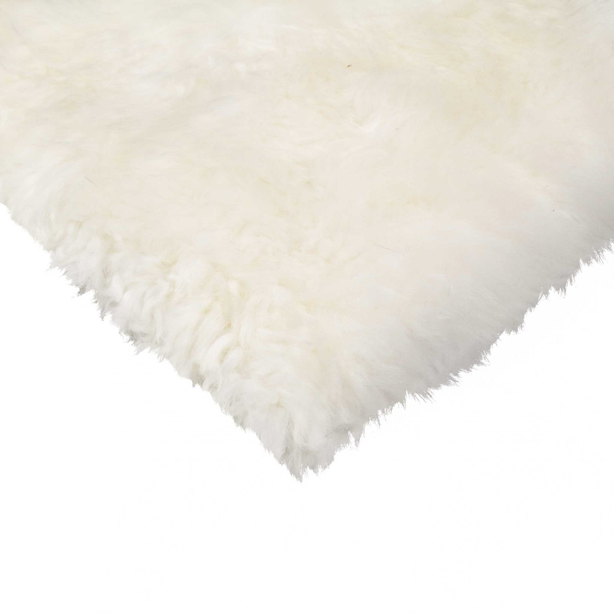 A luxurious 17x17 inches natural sheepskin chair seat cover showcasing its soft texture and elegant design, perfect for enhancing furniture.