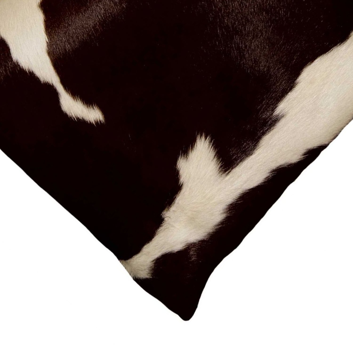 Luxurious 18x18 black cowhide pillow with unique mottling and soft microsuede backing, featuring a hidden zipper closure.