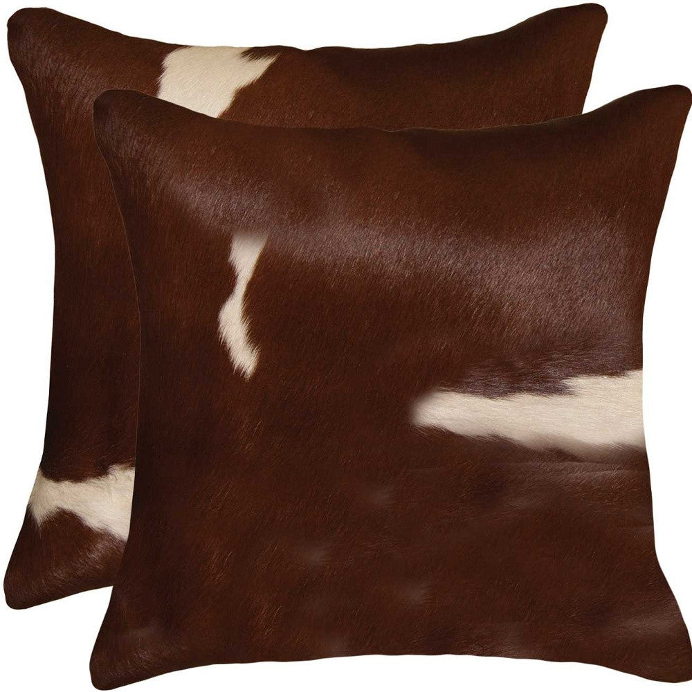 Luxurious 18x18 Gold and Chocolate Quattro Pillow set made from 100% Indian cowhide, featuring a hidden zipper and soft microsuede backing.