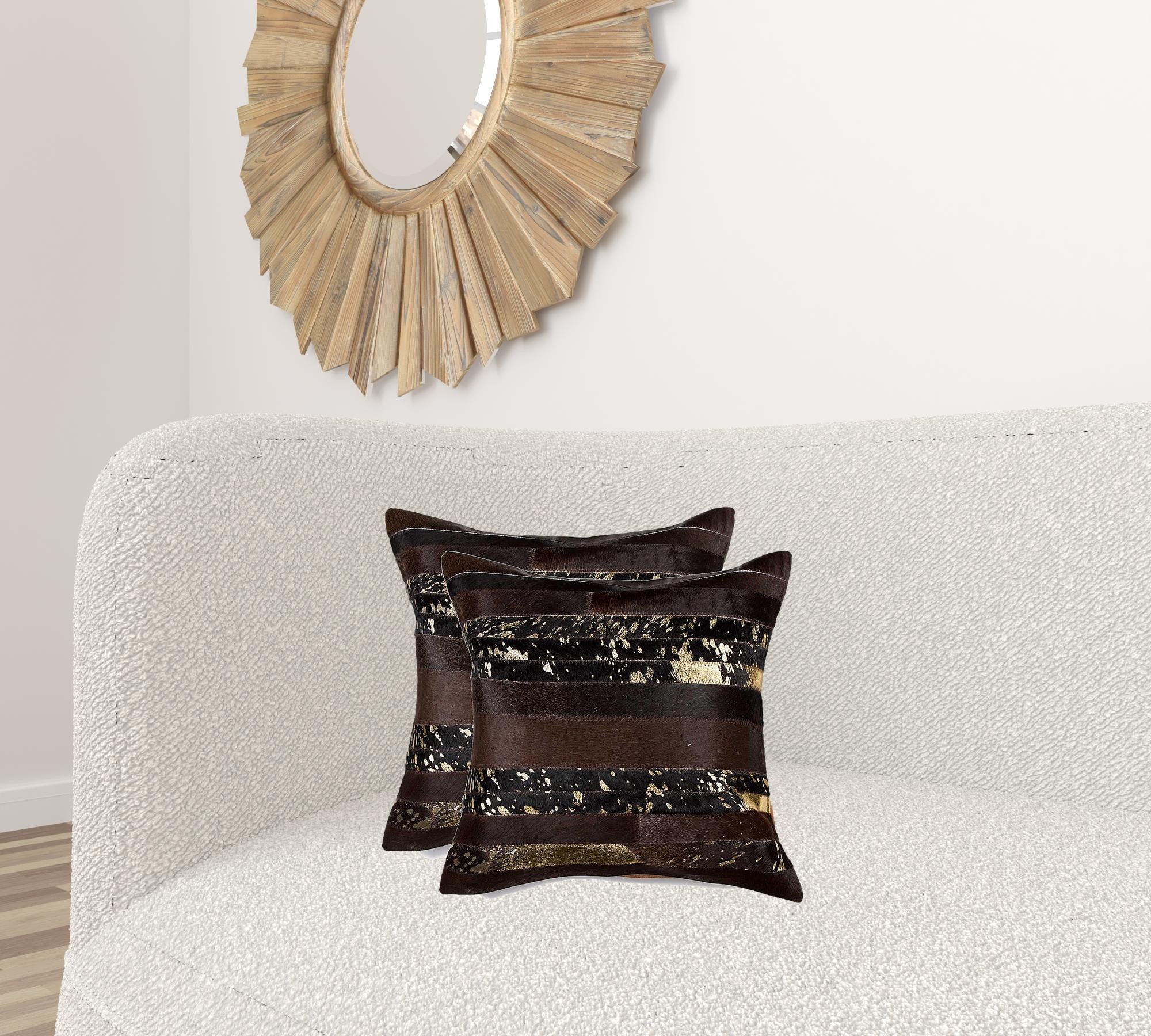 Luxurious 18x18 Gold and Chocolate Quattro Pillow set made from 100% Indian cowhide, featuring a hidden zipper and soft microsuede backing.