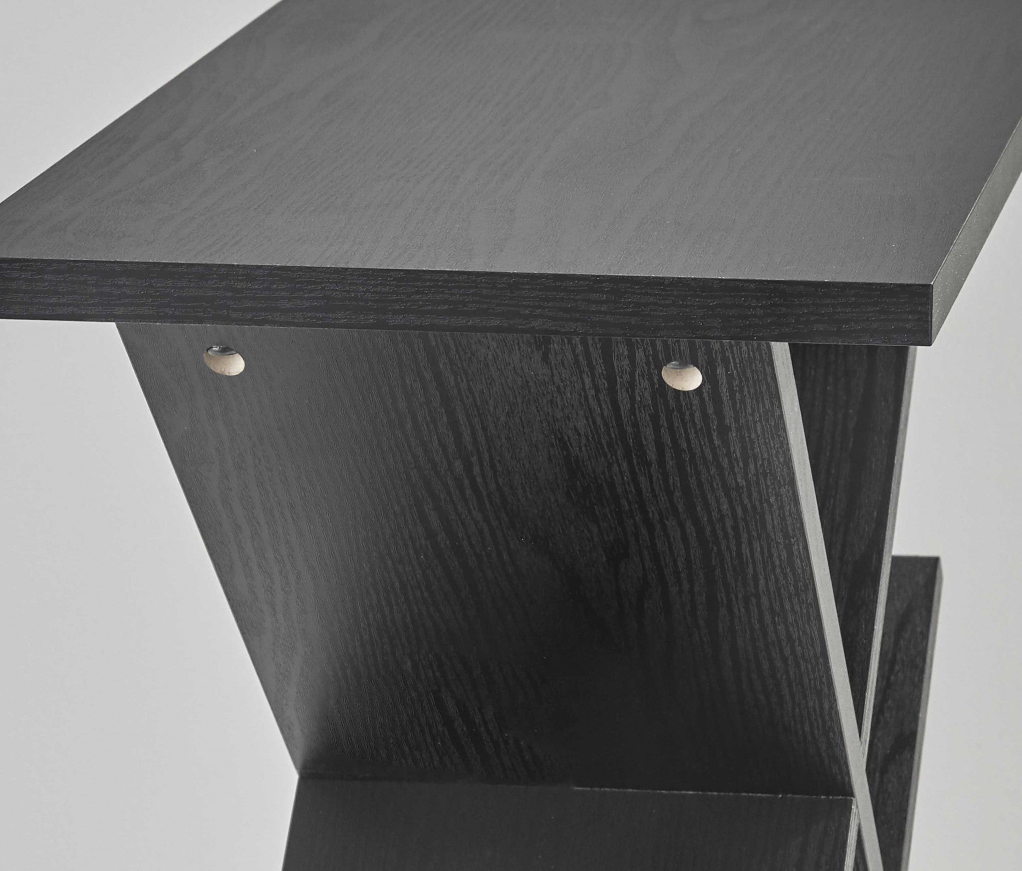 A sleek black accent table measuring 19x12x21.5 inches, featuring 8 deep storage compartments and a modern design.