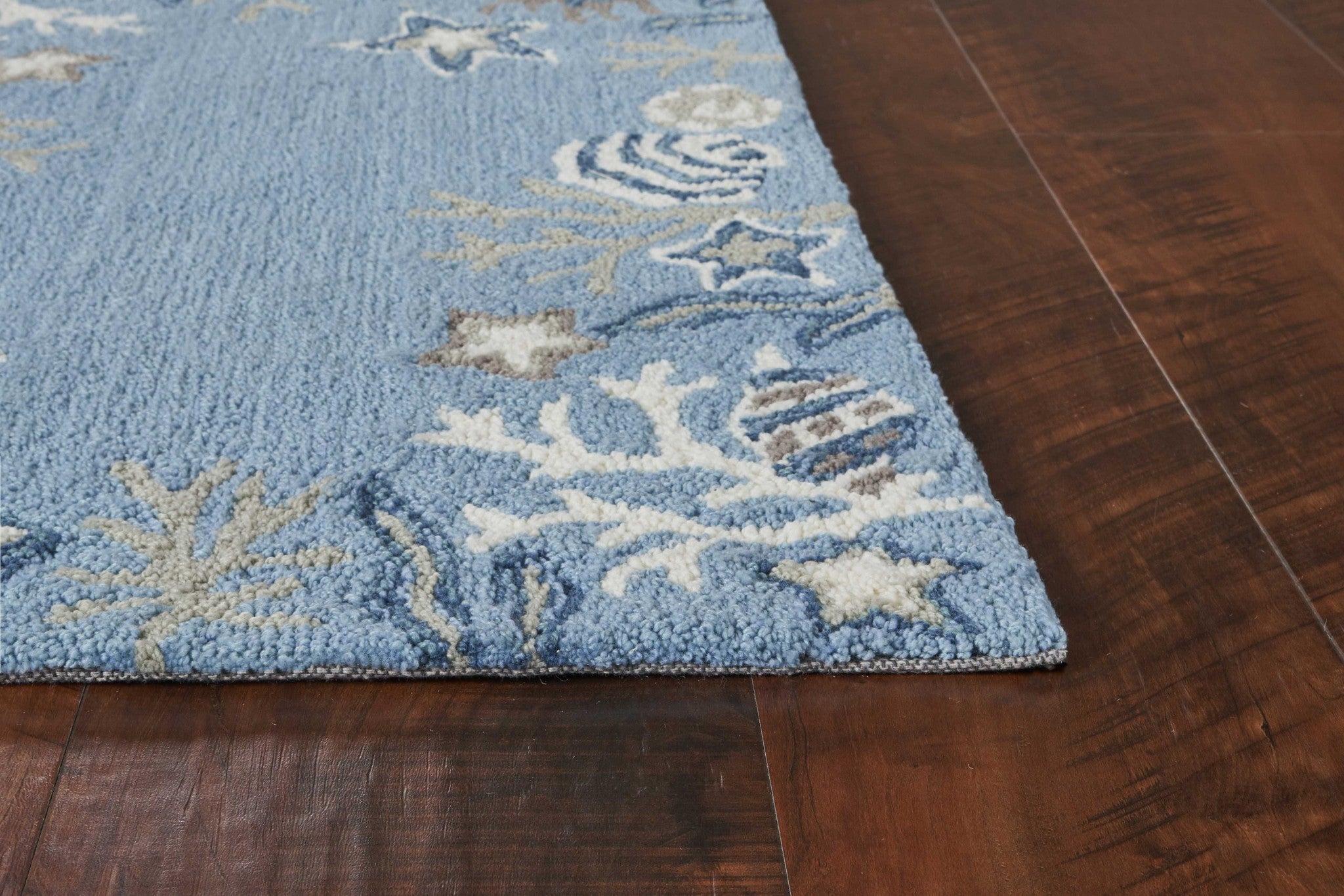 A beautiful 1x2 inches sea blue area rug made of polyester, showcasing a hand-hooked design with a contemporary style, perfect for modern living spaces.