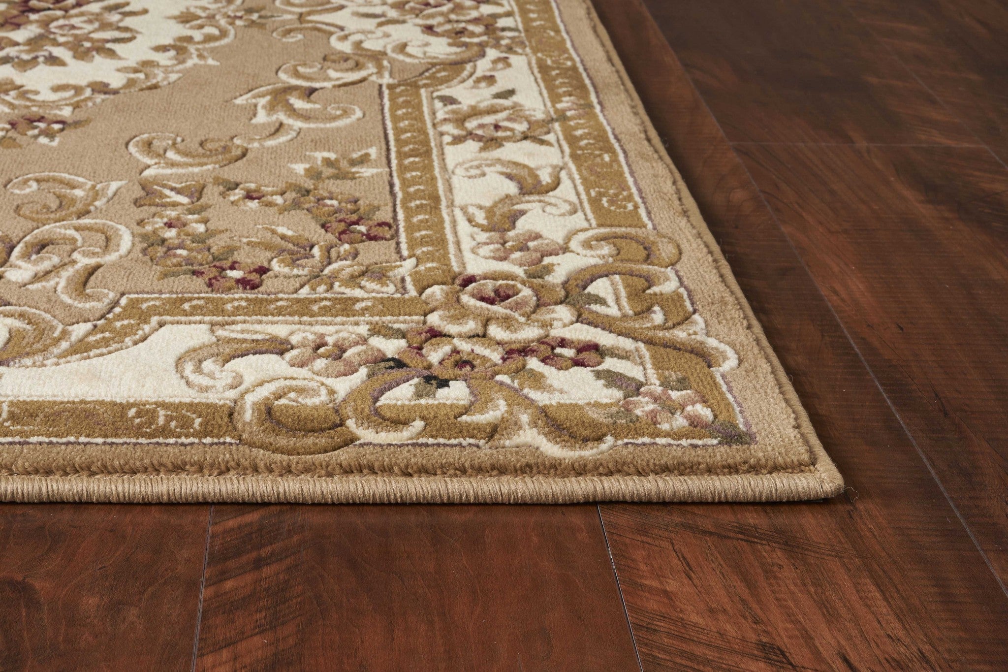 A beautiful beige and ivory area rug measuring 1x2 inches, showcasing intricate hand-carved details and a soft polypropylene texture.