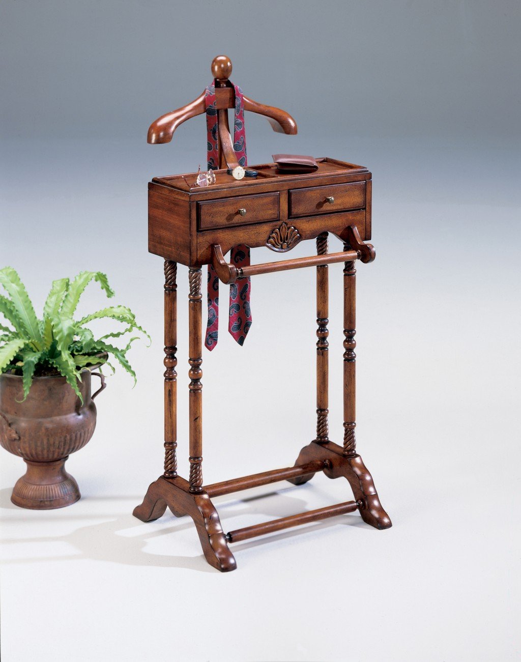 Elegant 2 Drawer Brown Hand Crafted Solid Wood Valet with Antique Brass Finish, featuring a sculptured wood hanger and two drawers.