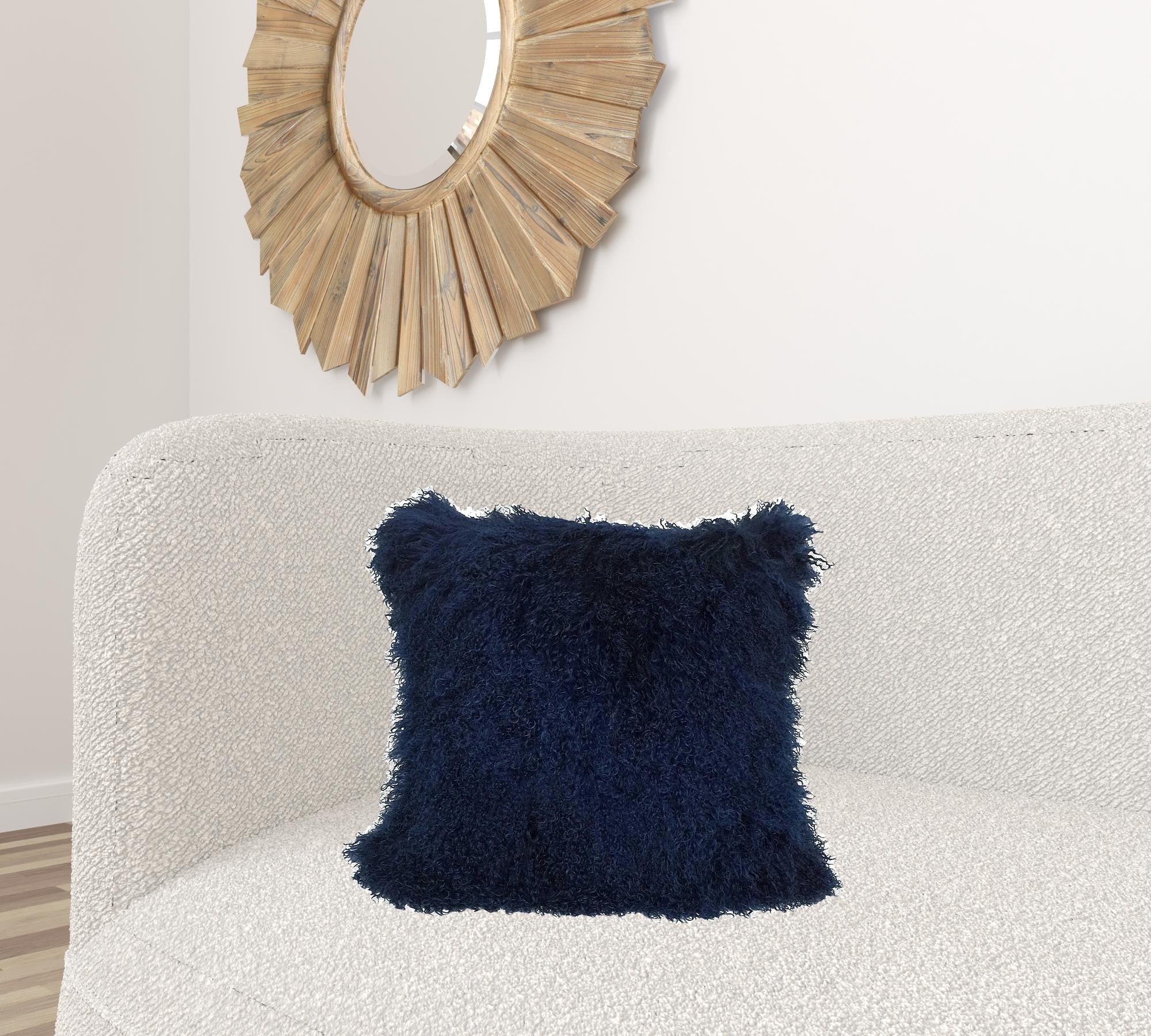 20-inch navy blue genuine Tibetan lamb fur pillow with microsuede backing, showcasing its plush texture and elegant design.