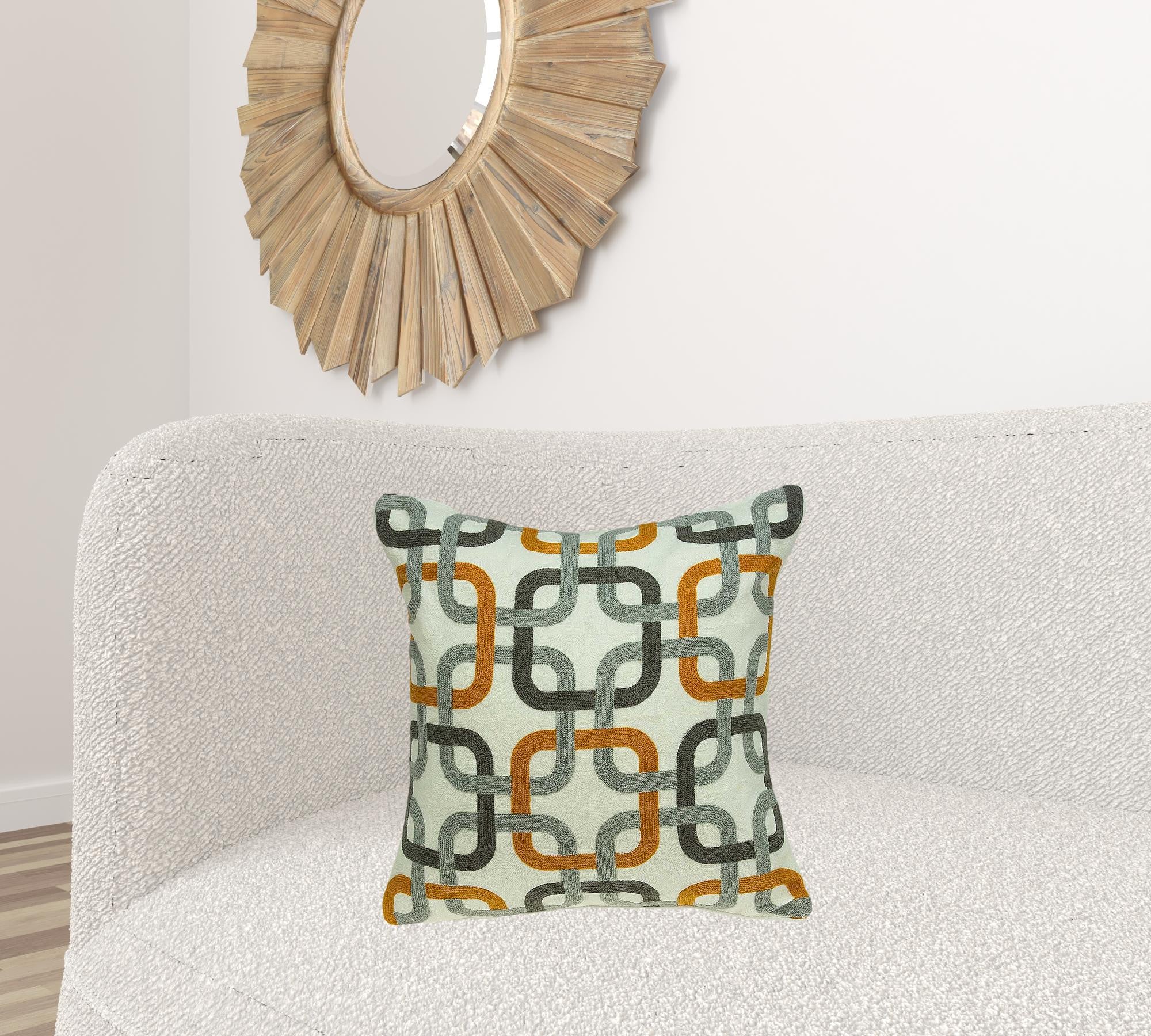 Multicolor decorative pillow cover featuring gray, orange, and black colors with a poly insert, perfect for home decor.