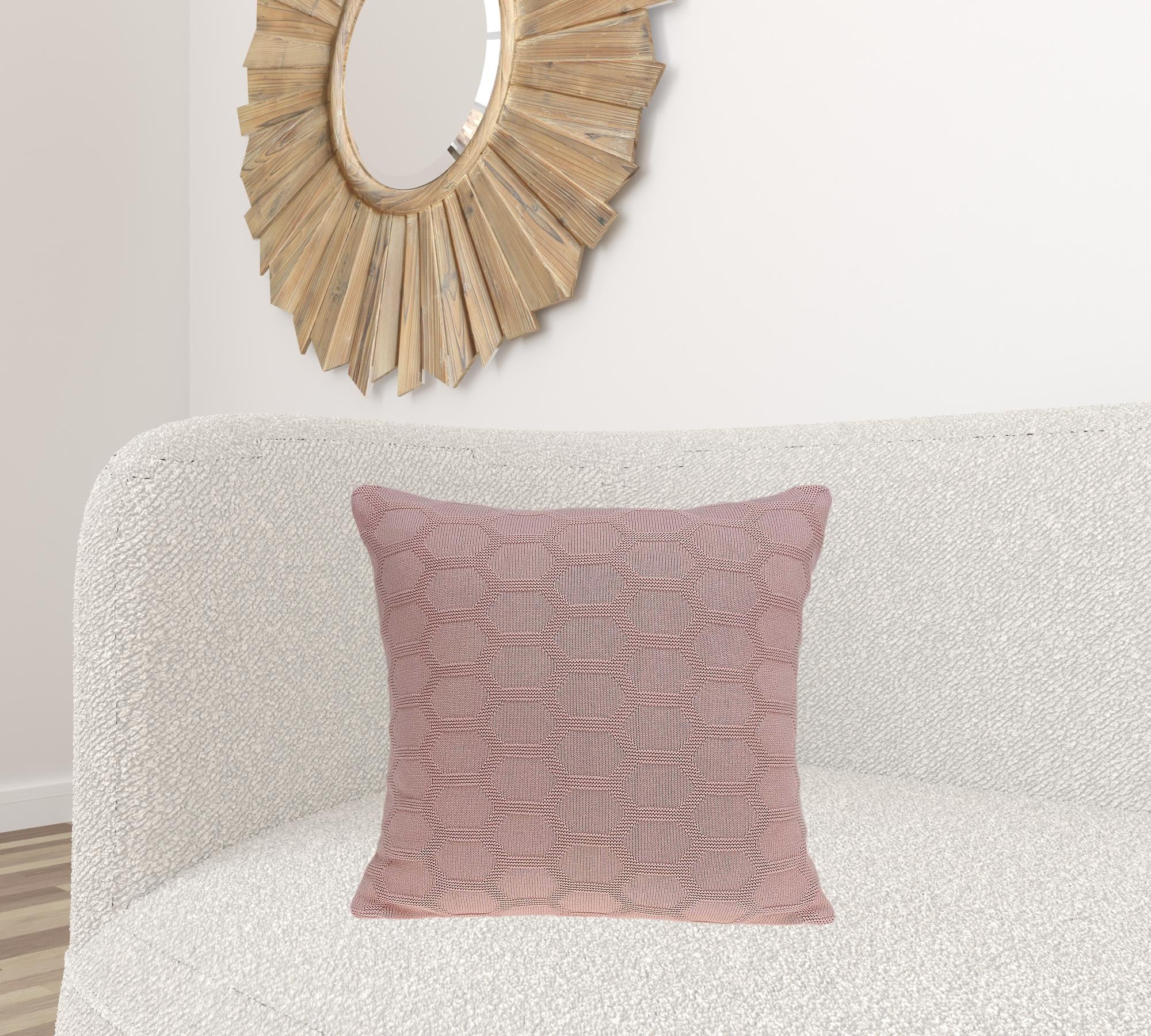 Transitional pink pillow cover measuring 20x7x20 inches, made from 100% cotton with a polyfill insert, featuring a honeycomb pattern.