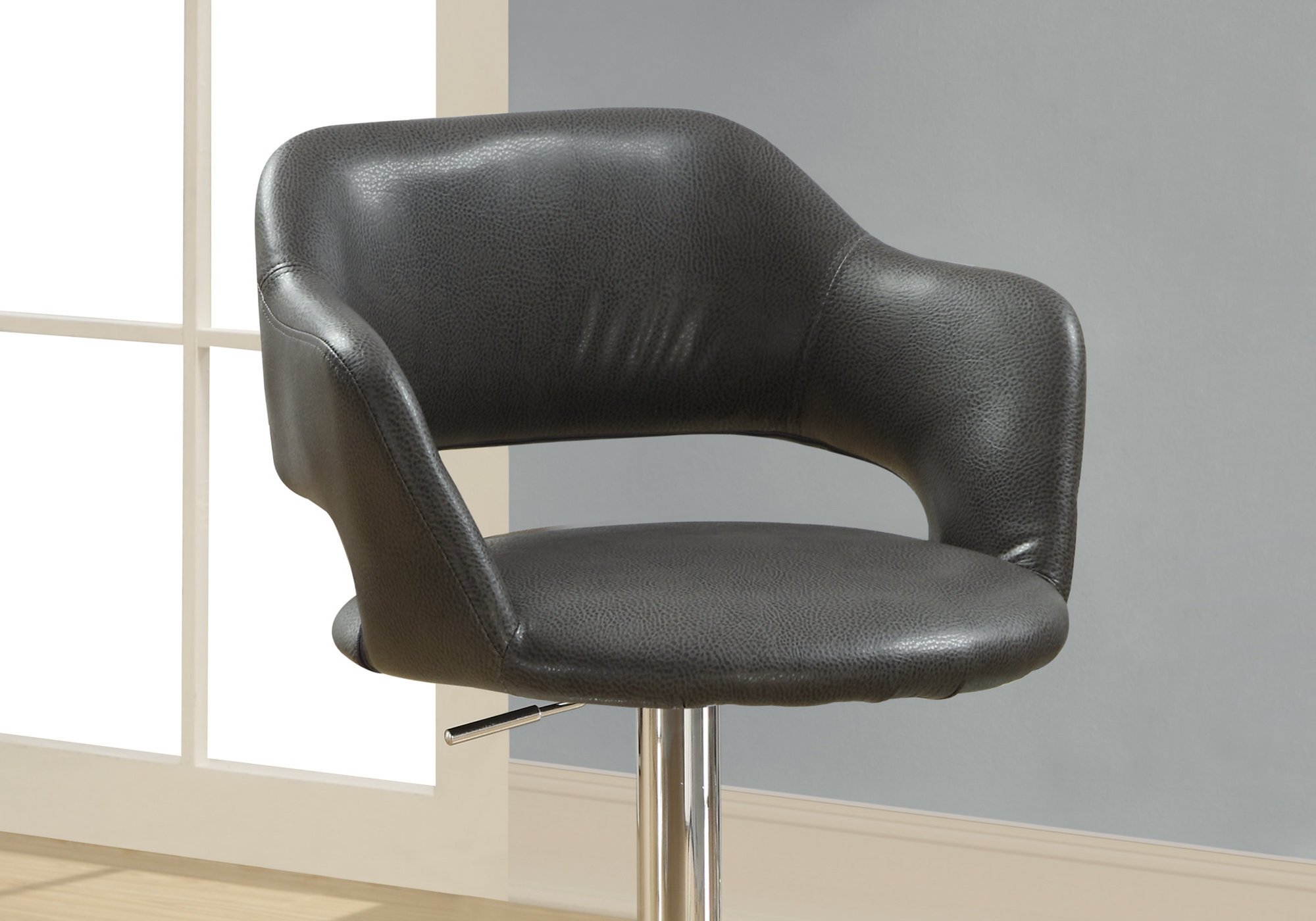 Stylish 21" x 22.5" x 36" charcoal foam metal leather look barstool with a shiny steel base and plush curved seat.