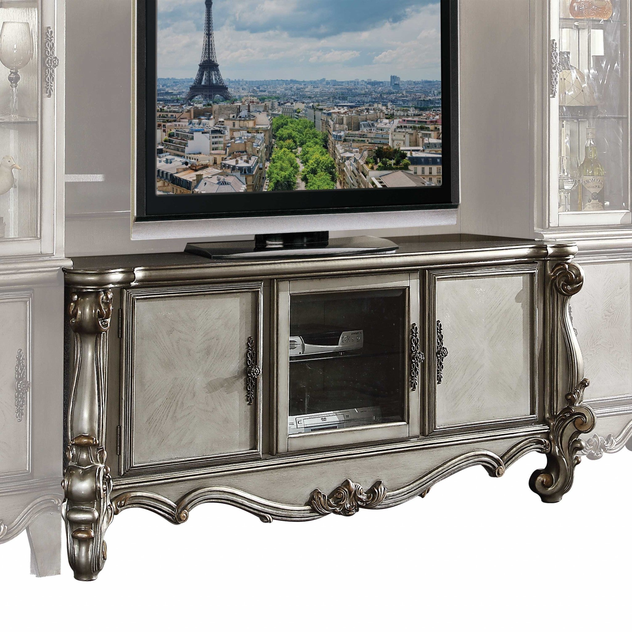 Antique Platinum Wood Poly Resin Glass TV Stand with vintage accents and spacious compartments, perfect for living room decor.